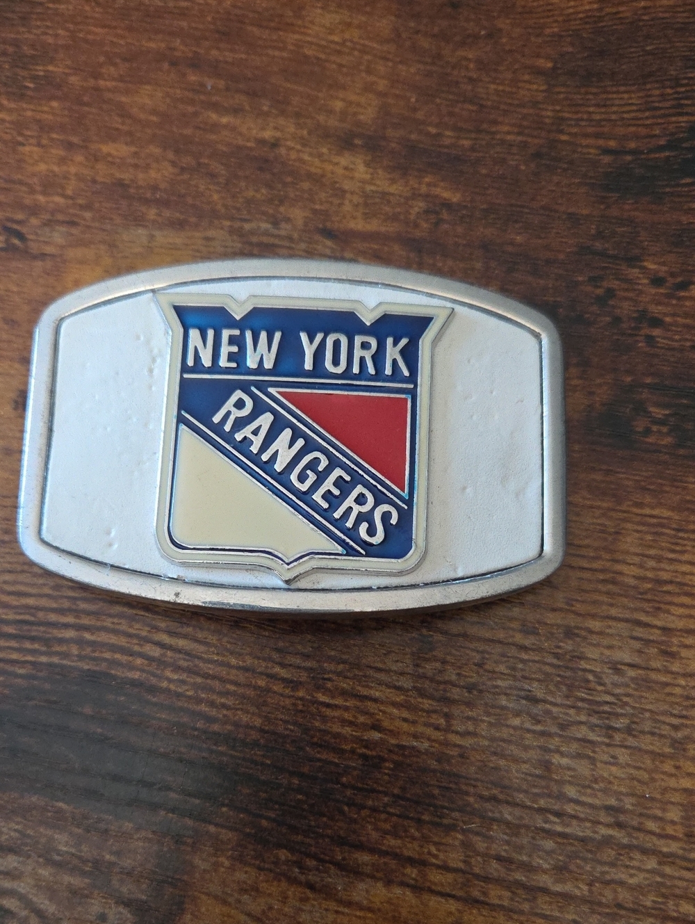 New York Rangers belt buckle featuring the team's classic shield logo.